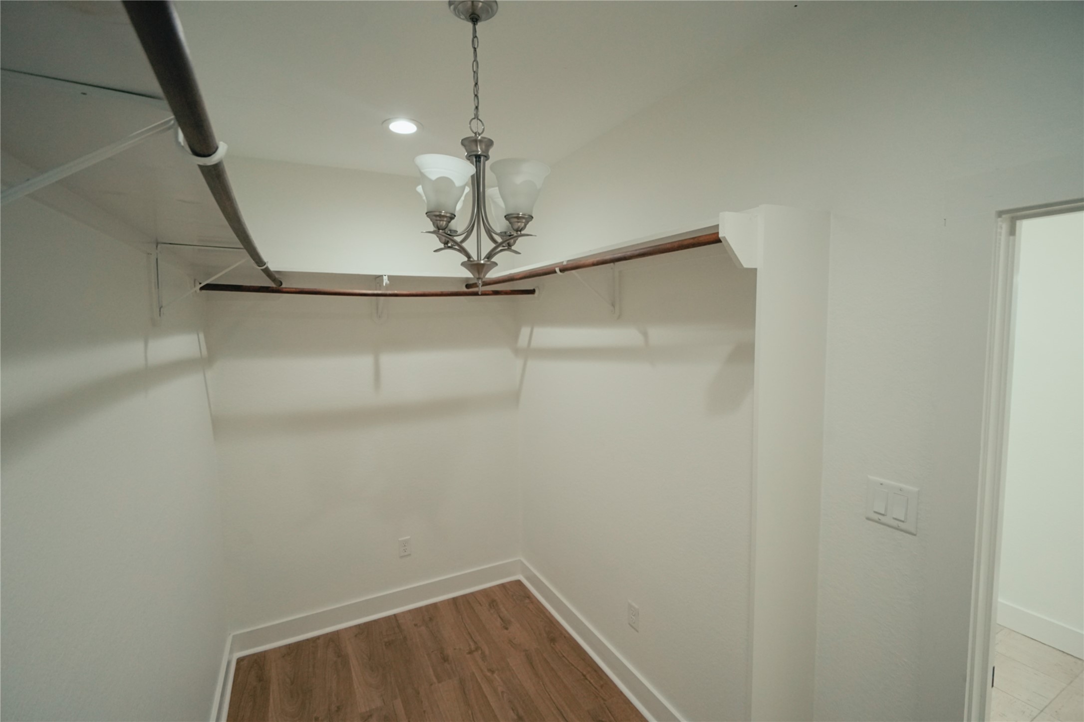 5105 Chapman Street Houston, TX 77009 - Photo 21 of 49 a view of a room with wooden floor and chandelier