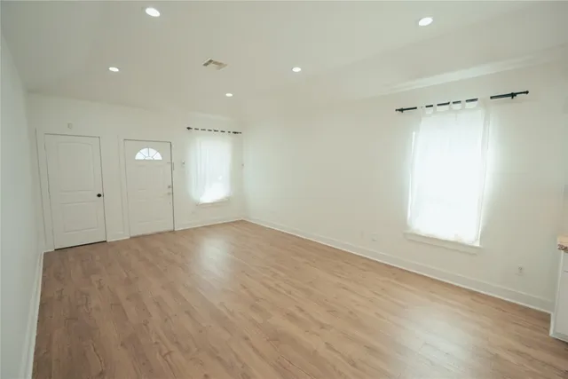 a view of an empty room with a window