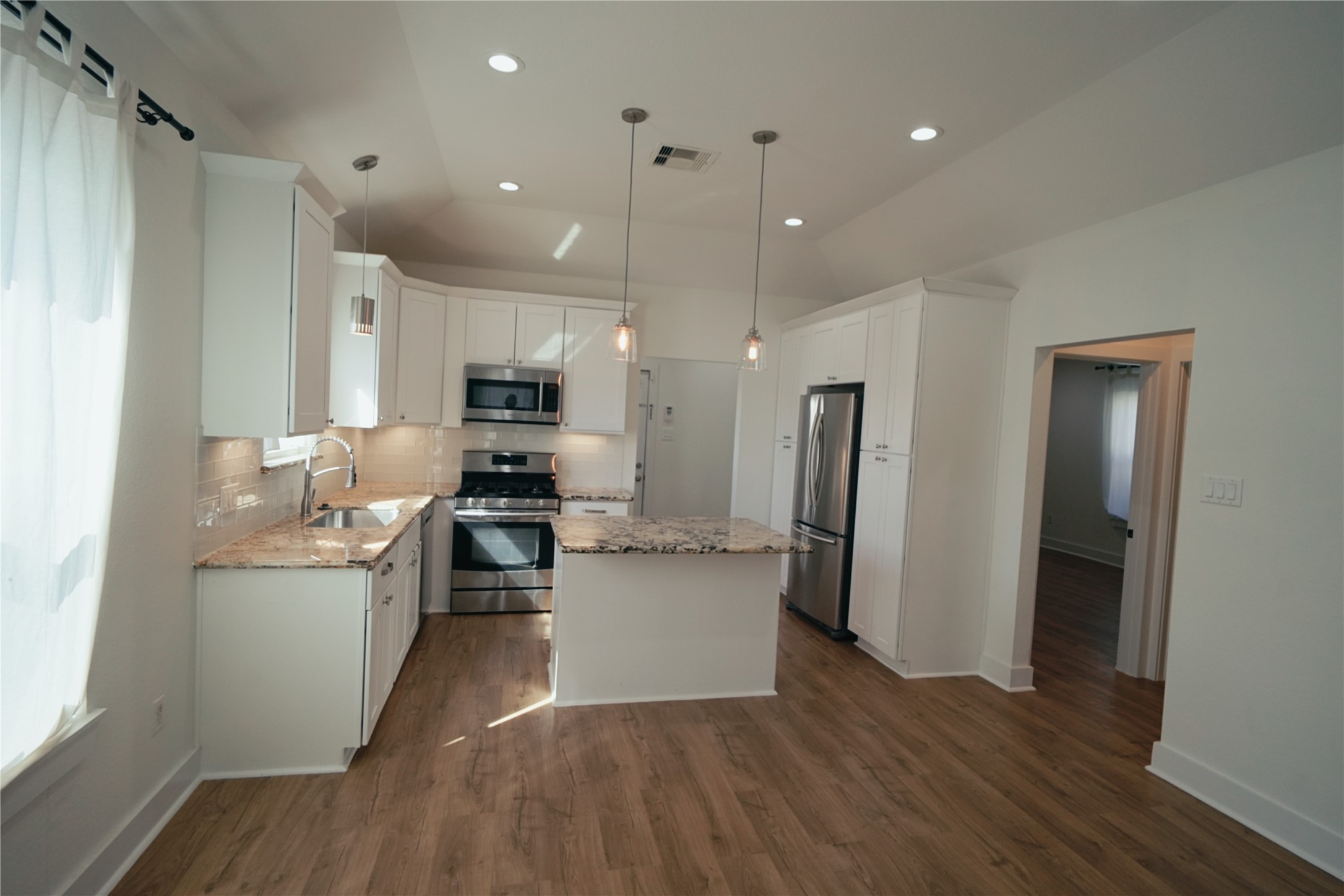 5105 Chapman Street Houston, TX 77009 - Photo 25 of 49 a kitchen with stainless steel appliances granite countertop a refrigerator stove and sink