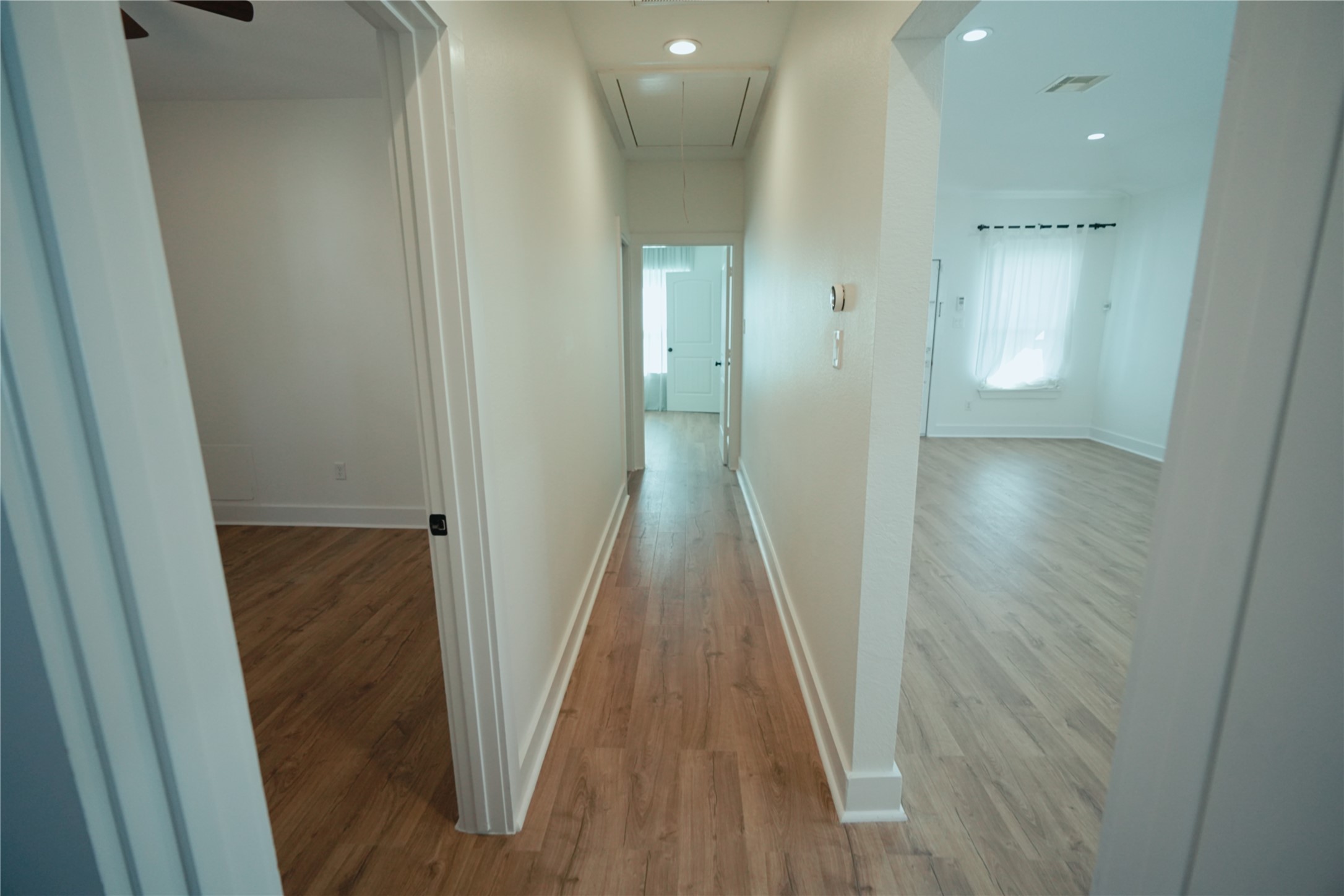 5105 Chapman Street Houston, TX 77009 - Photo 31 of 49 a view of a hallway with wooden floor