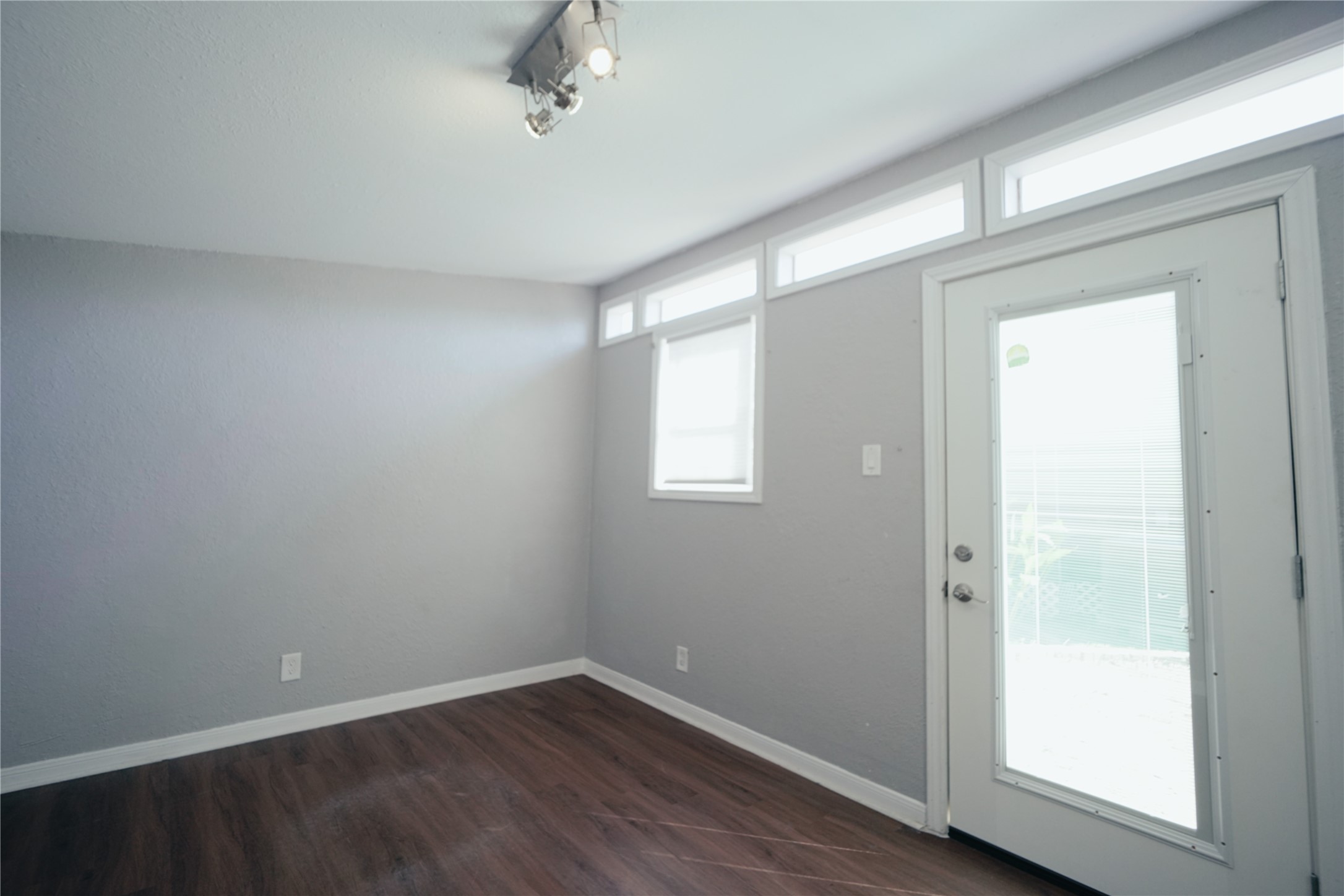 5105 Chapman Street Houston, TX 77009 - Photo 36 of 49 an empty room with wooden floor and windows