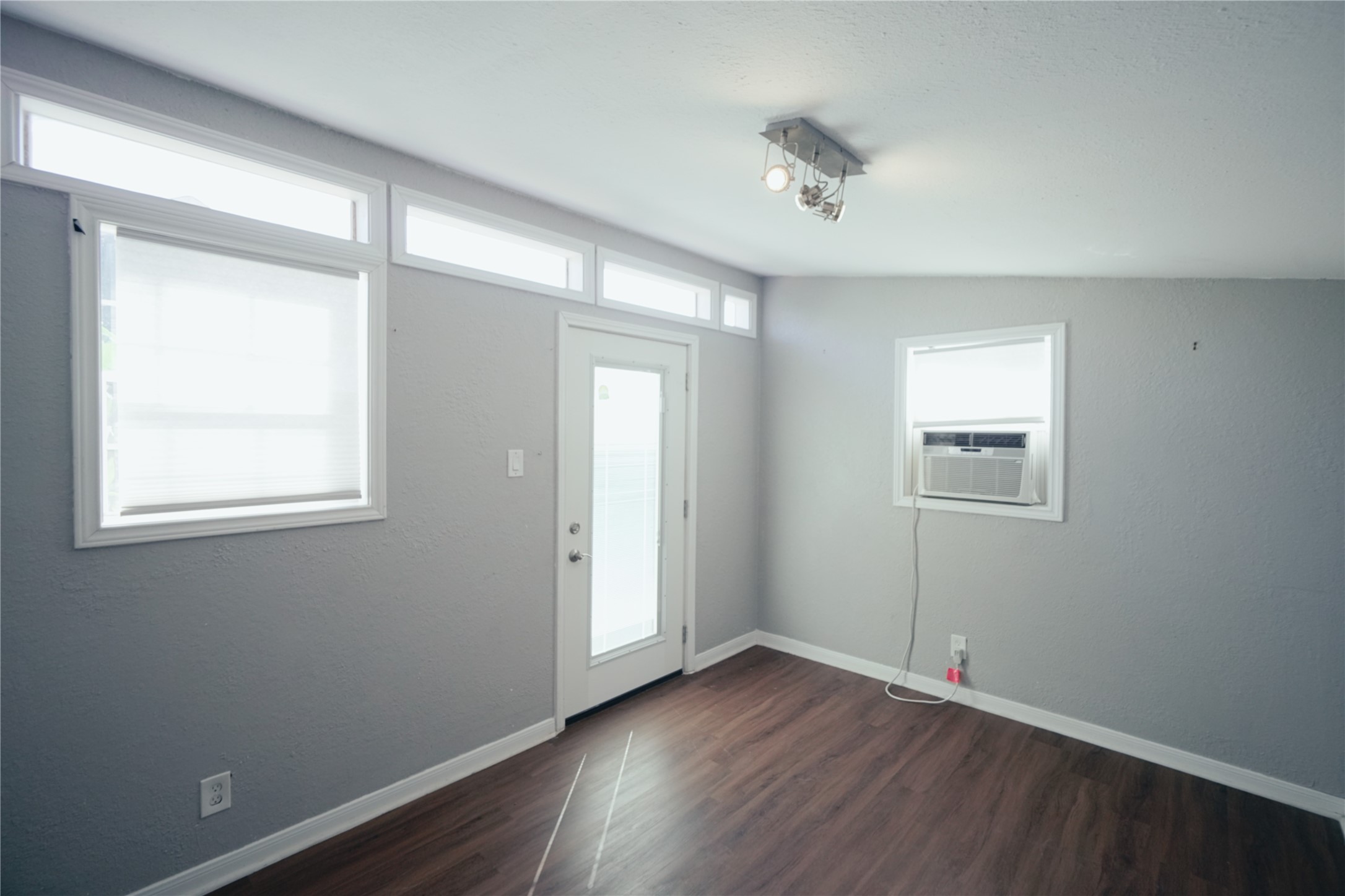 5105 Chapman Street Houston, TX 77009 - Photo 37 of 49 an empty room with wooden floor and windows