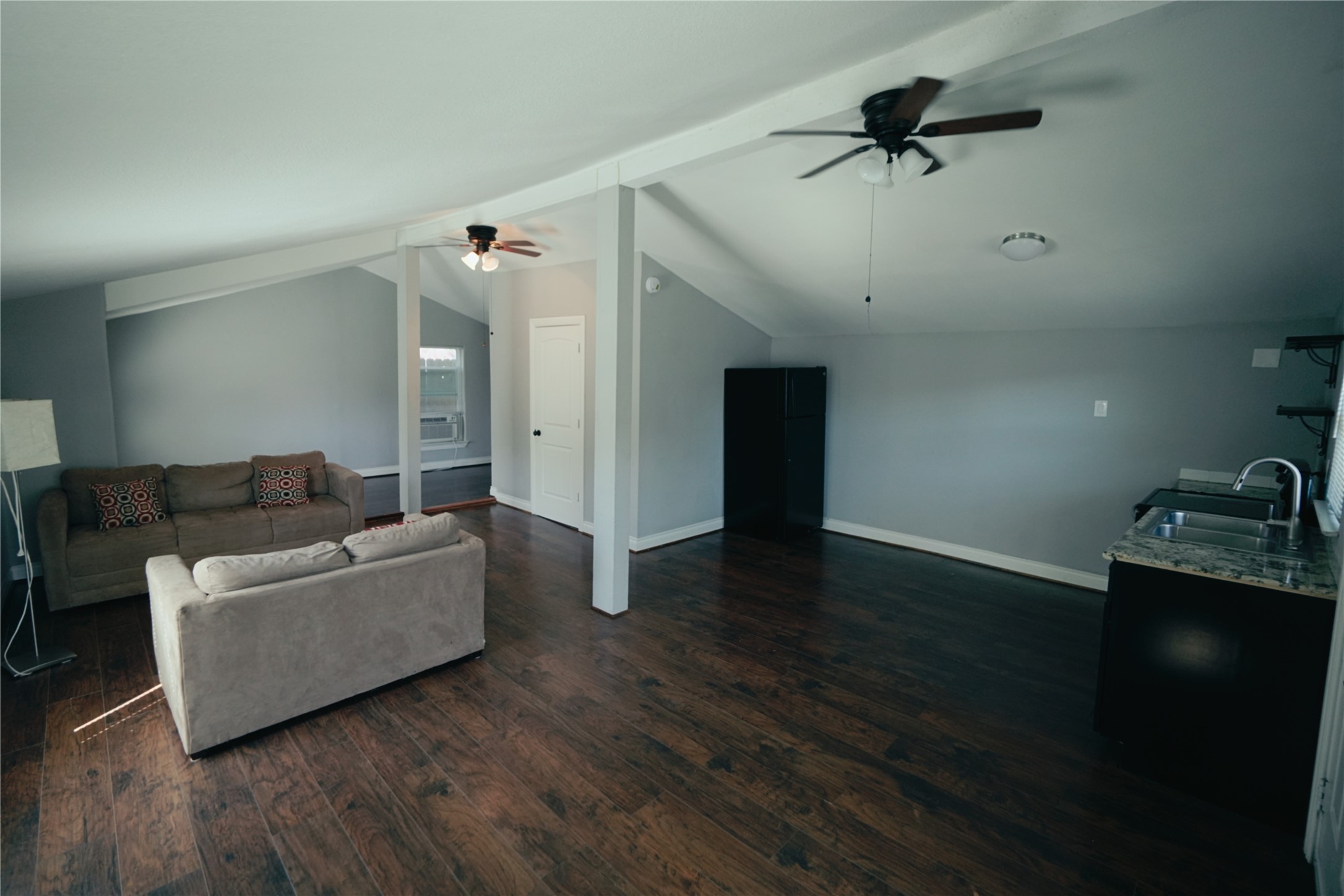 5105 Chapman Street Houston, TX 77009 - Photo 42 of 49 a living room with furniture and a wooden floor