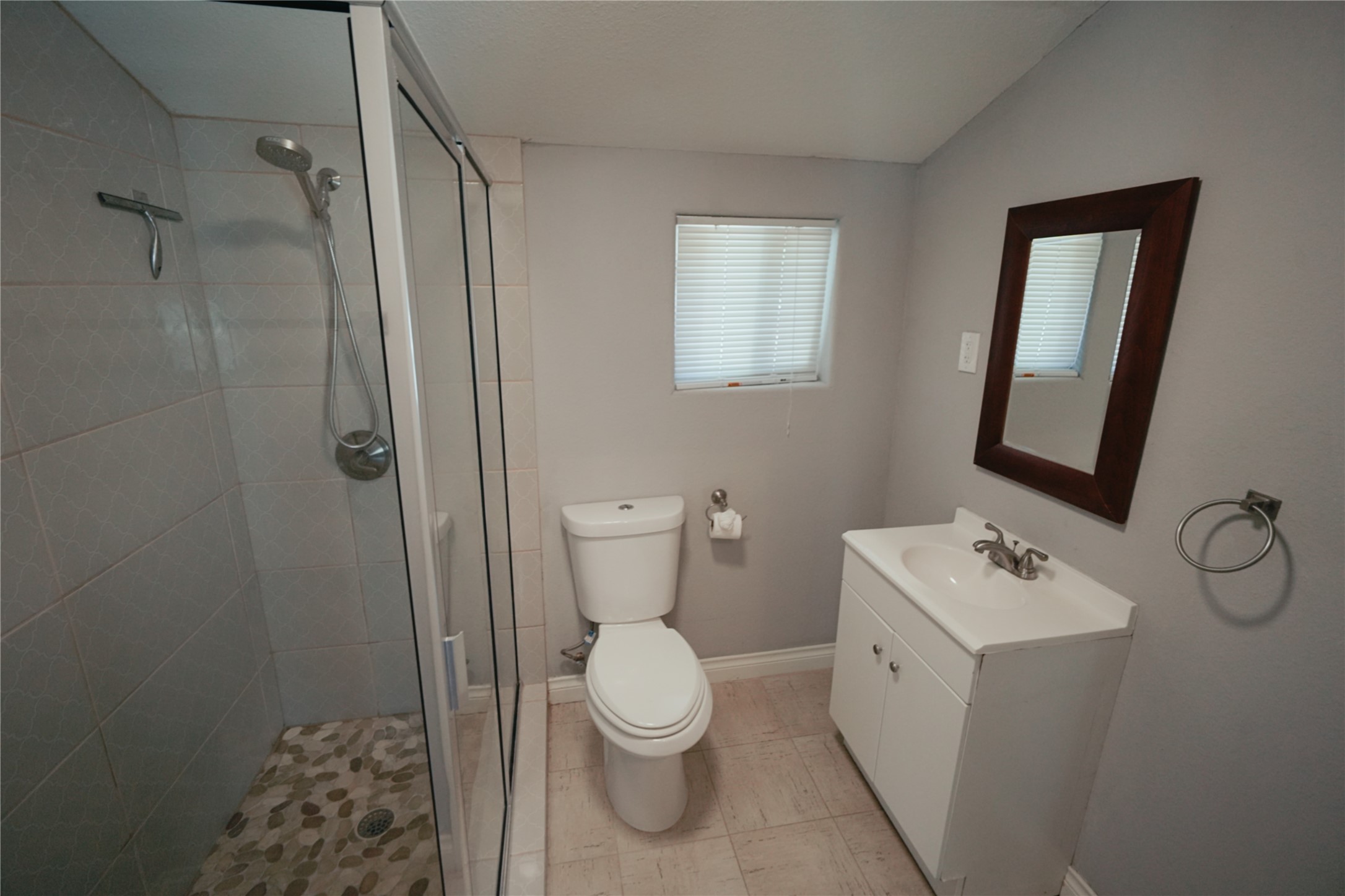5105 Chapman Street Houston, TX 77009 - Photo 46 of 49 a bathroom with a toilet sink and a mirror