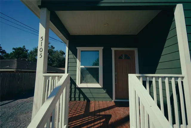 a balcony with view of car parked