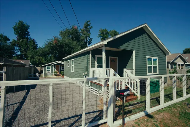 a front view of house with yard and outdoor seating