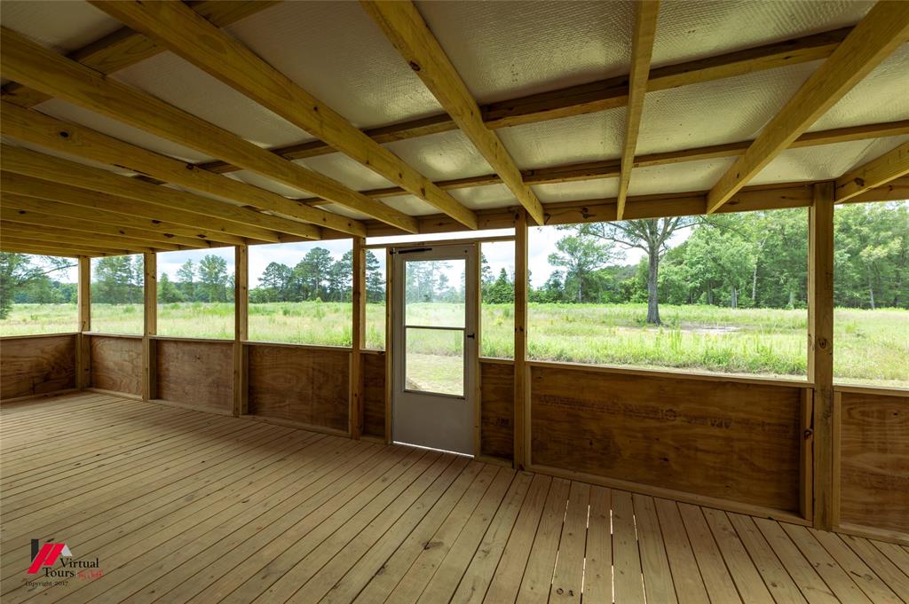 810 Chalybeate Springs Road Plain Dealing, LA 71064 - Photo 36 of 38 Large Fully Screened-In Back Porch