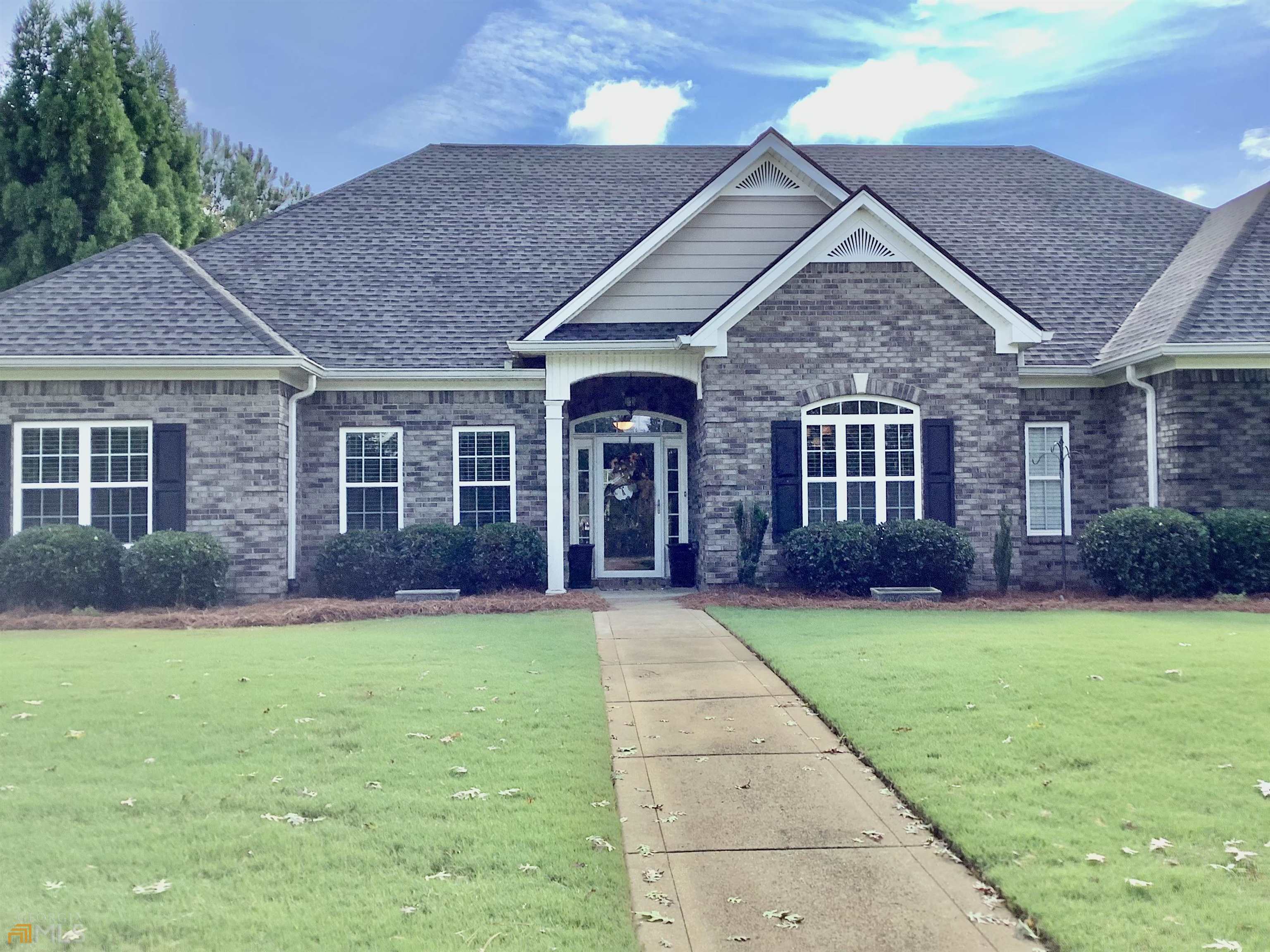 2 Fallen Branch Circle Southeast Rome, GA 30161 - Photo 1 of 1 a front view of a house with a garden