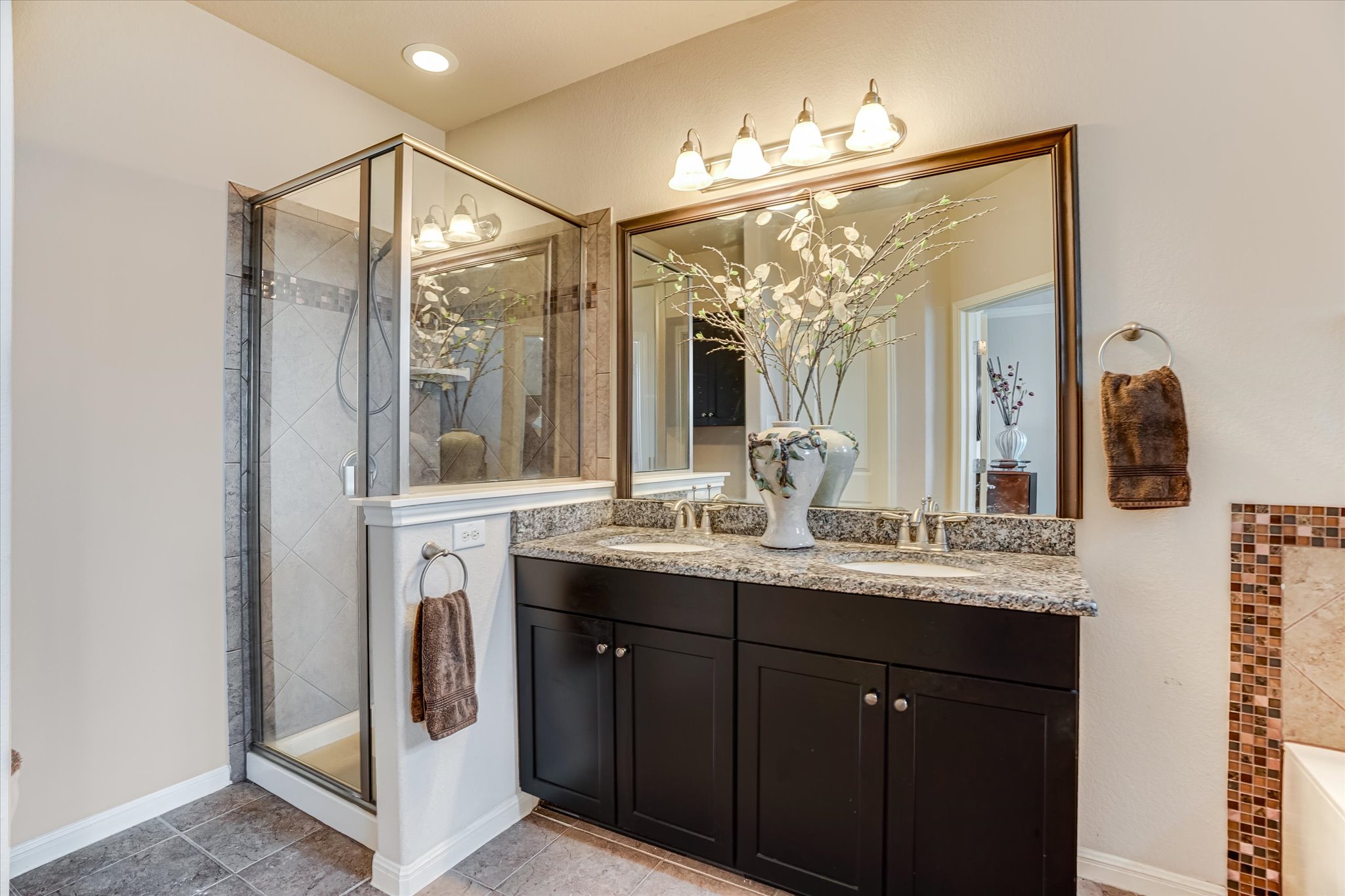14001 Avery Ranch Boulevard, Unit 202 Austin, TX 78717 - Photo 3 of 5 a en suite bathroom with a sink mirror and window