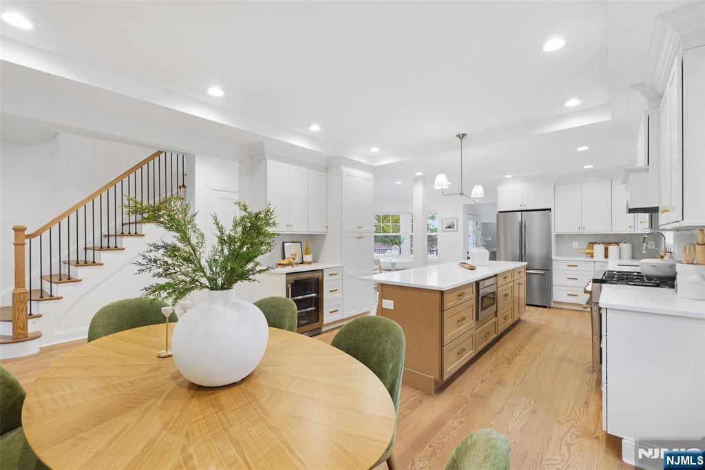 222 Ridge Road Rutherford, NJ 07070 - Photo 13 of 46 a kitchen with stainless steel appliances kitchen island granite countertop a granite counter tops and a view of living room