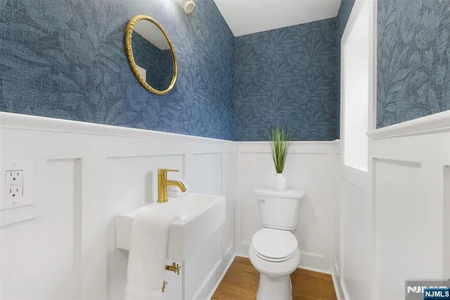 a bathroom with a toilet and a sink