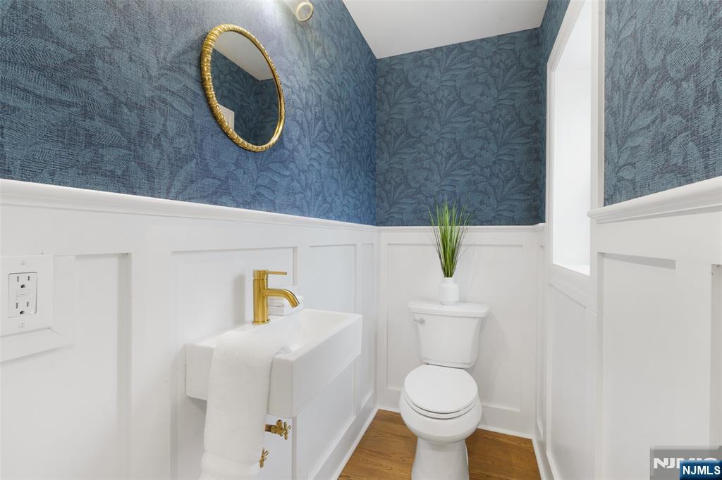 222 Ridge Road Rutherford, NJ 07070 - Photo 17 of 46 a bathroom with a toilet and a sink