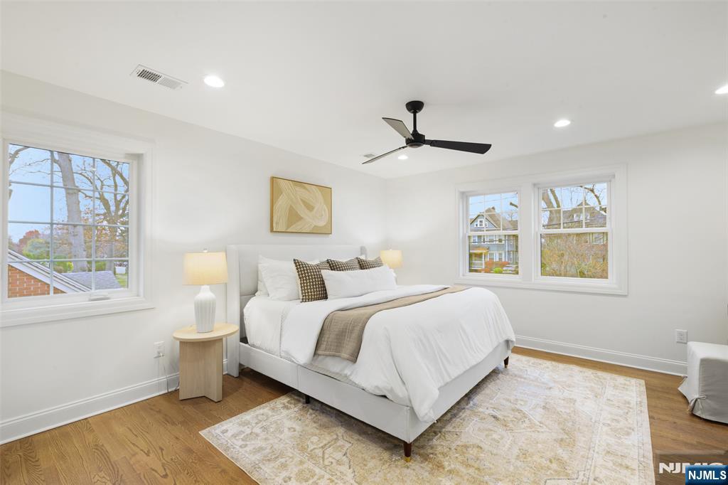 222 Ridge Road Rutherford, NJ 07070 - Photo 18 of 46 a bedroom with a large bed and a window