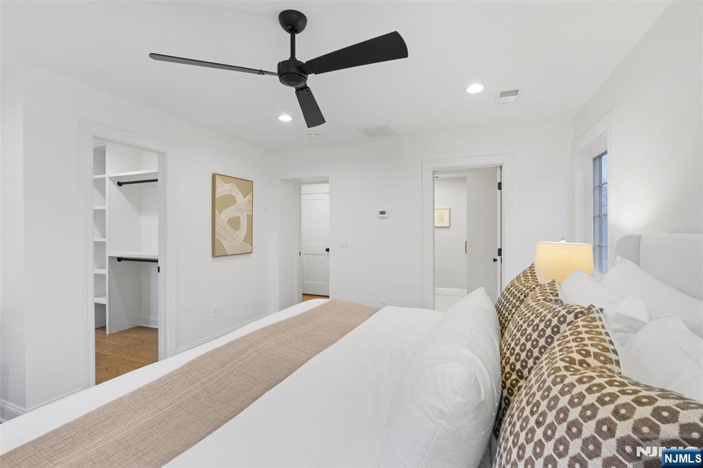 222 Ridge Road Rutherford, NJ 07070 - Photo 19 of 46 a bedroom with a bed and a painting on the wall