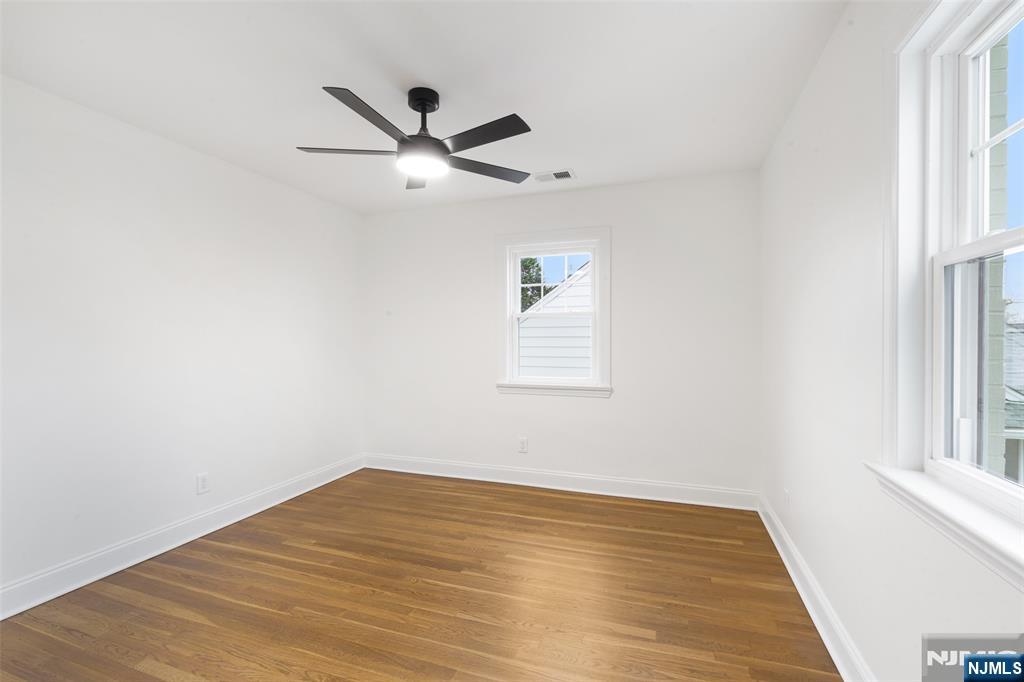 222 Ridge Road Rutherford, NJ 07070 - Photo 23 of 46 a view of a big room with wooden floor closet and windows