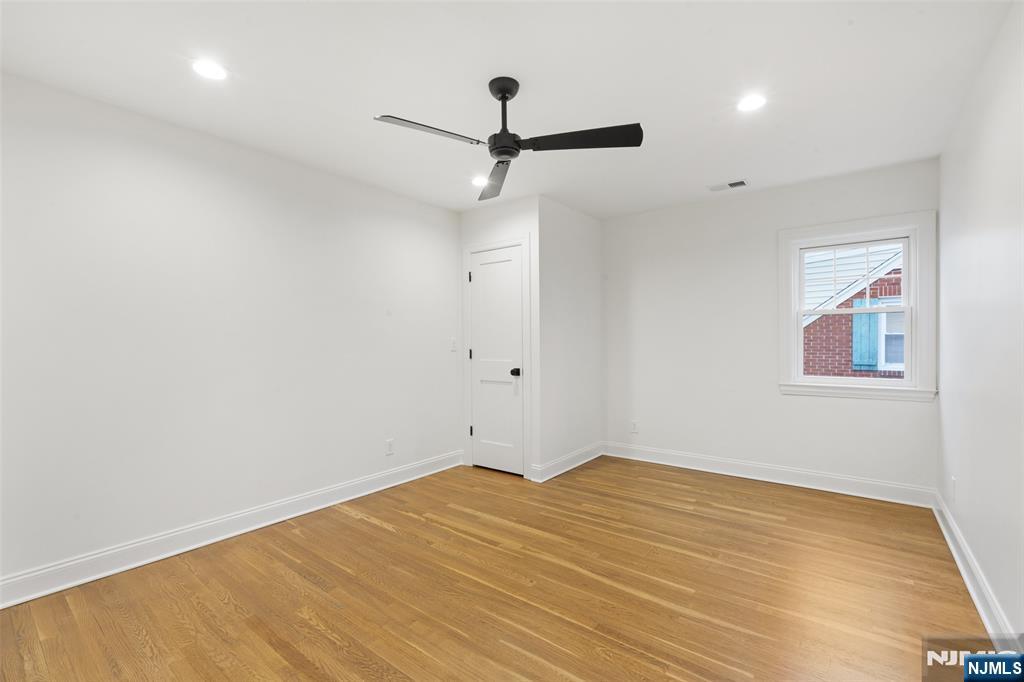 222 Ridge Road Rutherford, NJ 07070 - Photo 25 of 46 a view of empty room with wooden floor