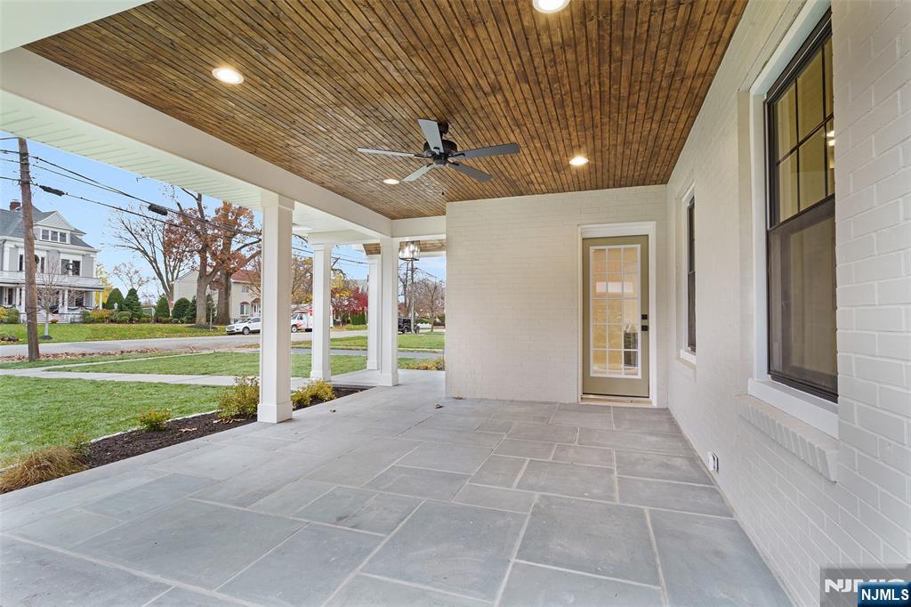 222 Ridge Road Rutherford, NJ 07070 - Photo 3 of 46 a view of a porch with furniture and a yard