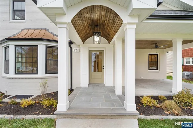 a front view of a house with a porch