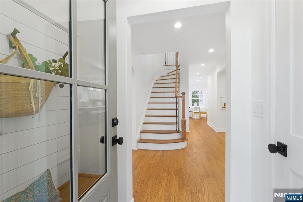 222 Ridge Road Rutherford, NJ 07070 - Photo 5 of 46 a view of a hallway with wooden floor and windows