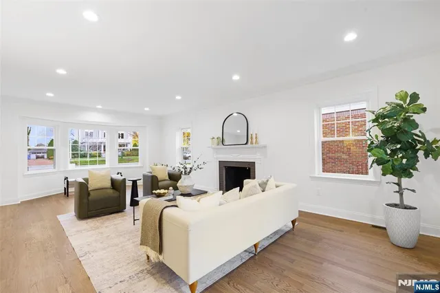 a bed room with furniture and a potted plant