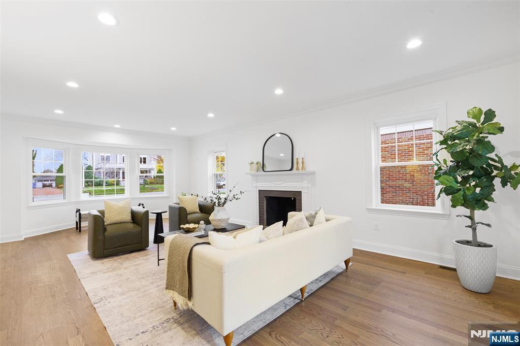 222 Ridge Road Rutherford, NJ 07070 - Photo 8 of 46 a bed room with furniture and a potted plant