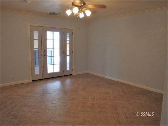 412 North Mono Street Ridgecrest, CA 93555 - Photo 36 of 50 wooden floor in an empty room with a window