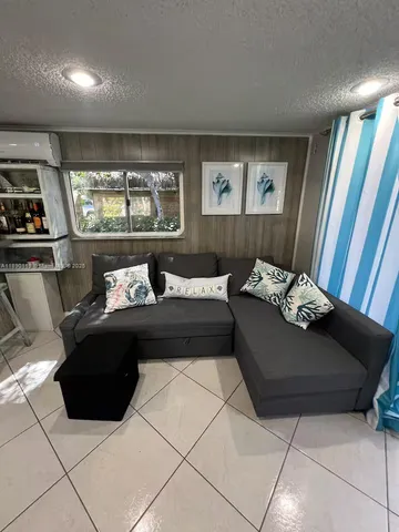 a kitchen with a sink a counter top space appliances and cabinets