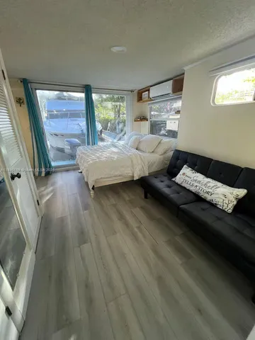 a bedroom with bed and window