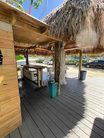 a living room with a couch and potted plants