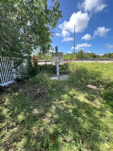a view of a wrought iron fences in front of house