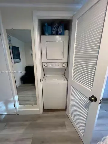 a kitchen with stainless steel appliances kitchen island granite countertop a sink and cabinets