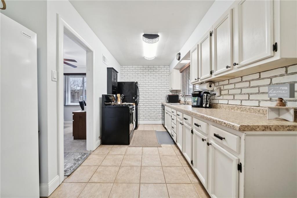 2443 Brodhead Road Aliquippa, PA 15001 - Photo 11 of 32 Well equipped kitchen with ample cabinetry and counter space.