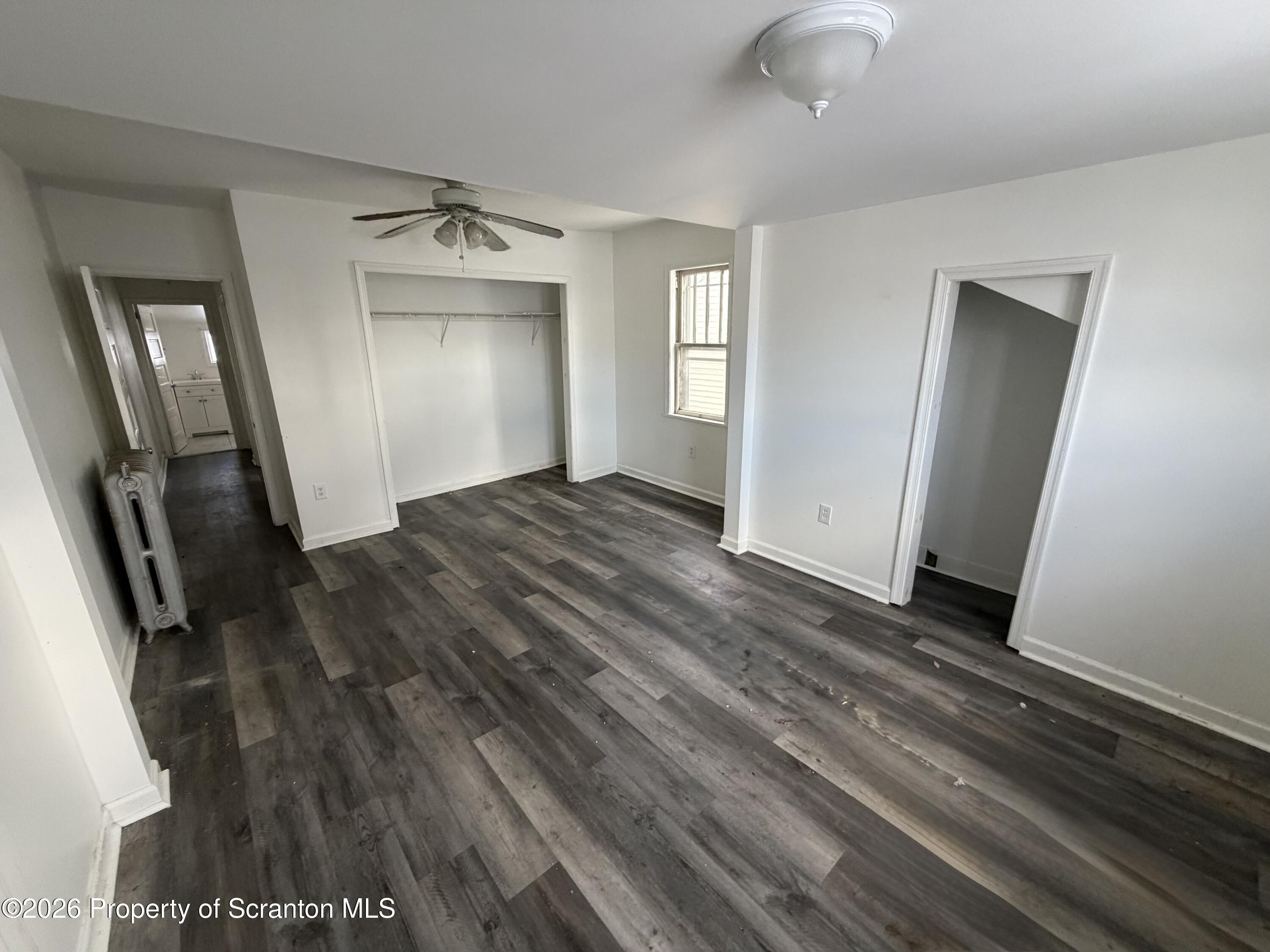 202 William Street Scranton, PA 18508 - Photo 11 of 11 wooden floor in an empty room with a mirror
