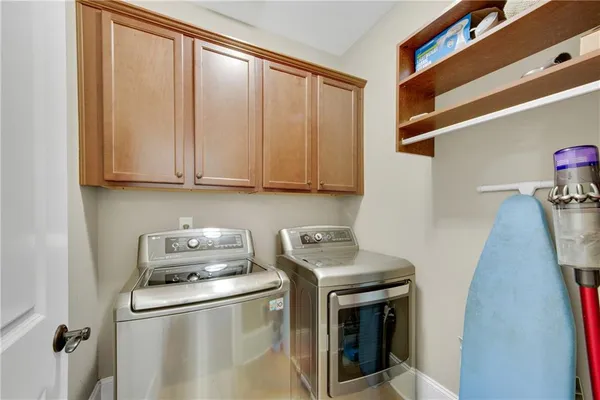 a spacious bathroom with a granite countertop tub sink and mirror