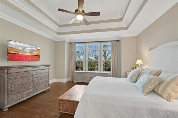 a living room with furniture a fireplace and a floor to ceiling window