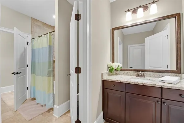 a kitchen with stainless steel appliances granite countertop a stove top oven a sink with island and chairs