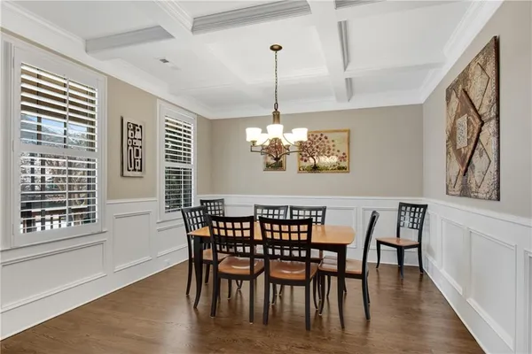 a large kitchen with kitchen island lots of counter space a sink appliances and a living room view