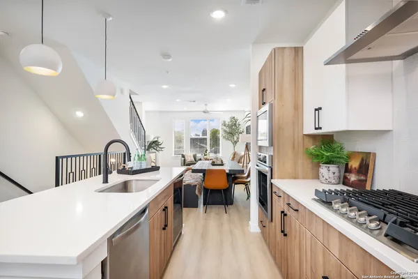 a kitchen with sink and stove