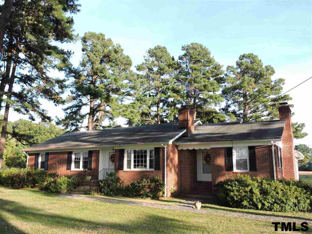 front view of a house with a garden