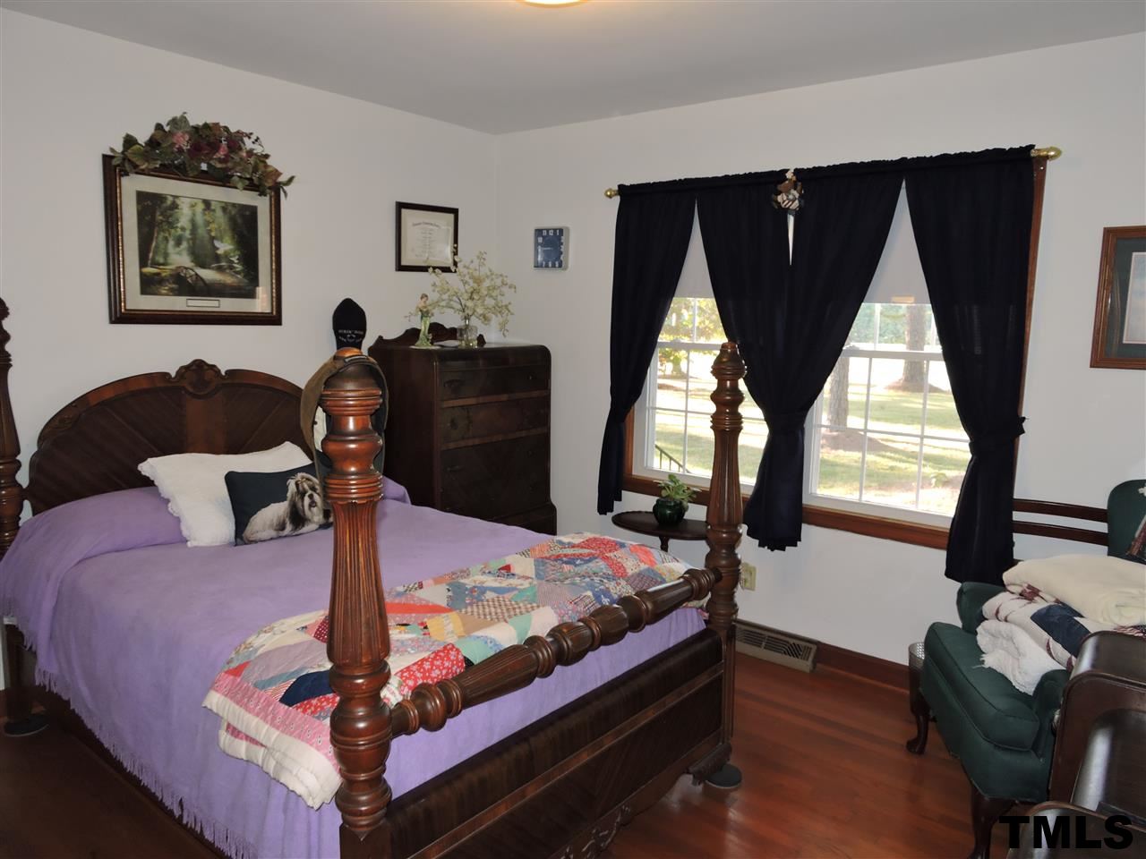 910 Antioch Church Road Timberlake, NC 27583 - Photo 6 of 22 a bed room with a bed and balcony