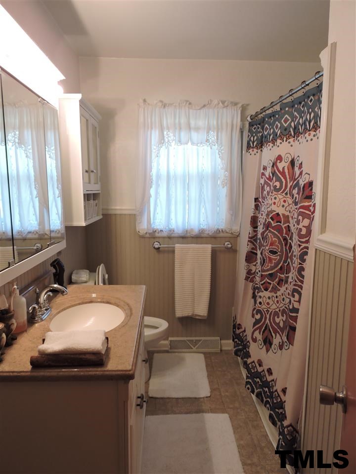 910 Antioch Church Road Timberlake, NC 27583 - Photo 9 of 22 a bathroom with a sink toilet and shower