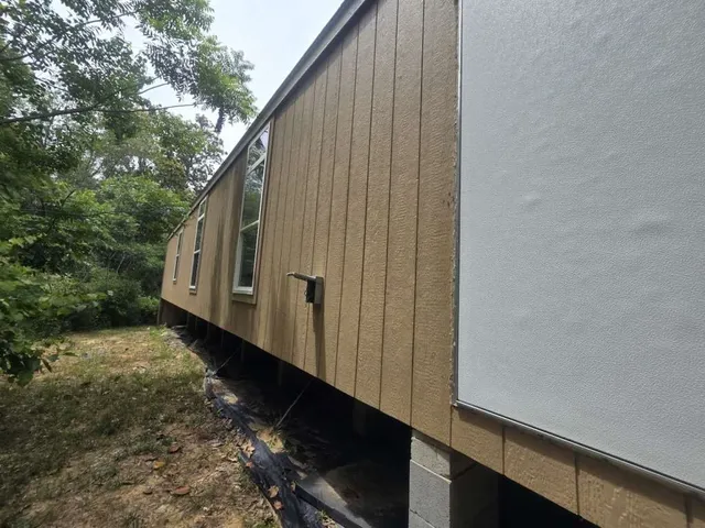 a view of a back yard of the house