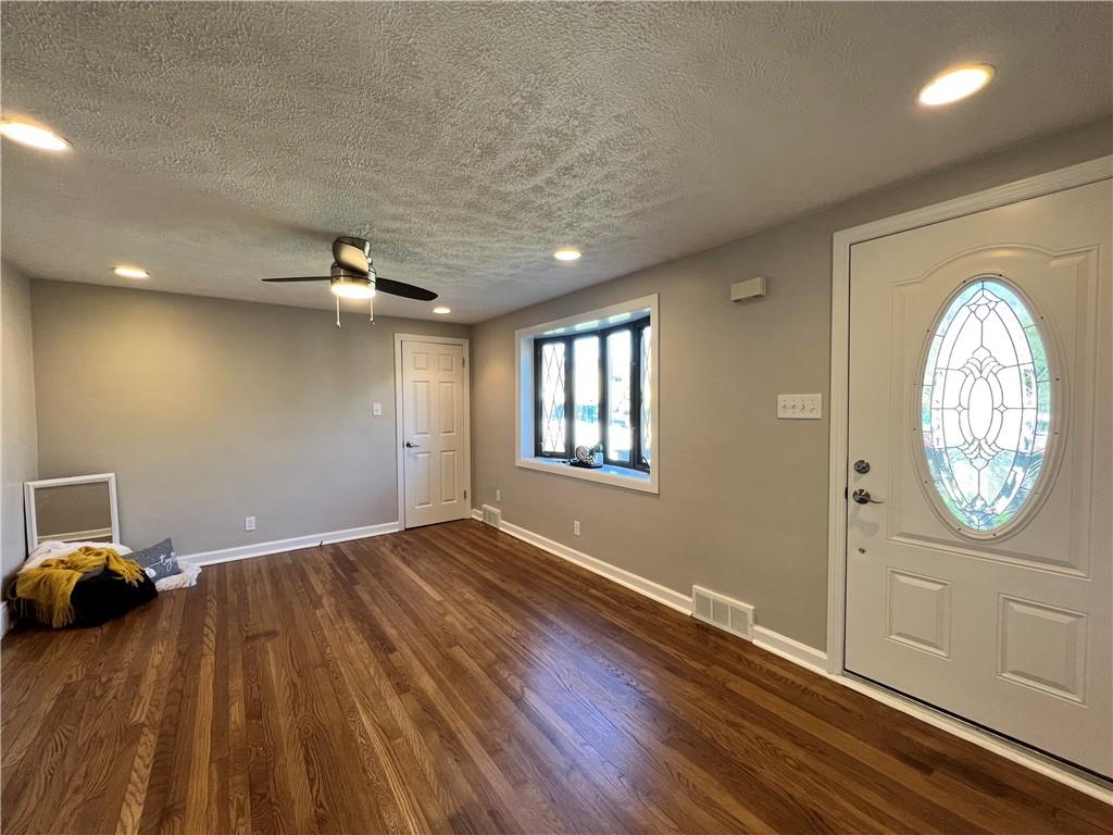 901 Greenhill Road Pittsburgh, PA 15209 - Photo 5 of 31 a view of a livingroom with wooden floor and furniture
