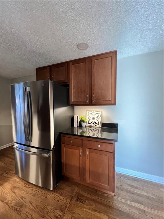 901 Greenhill Road Pittsburgh, PA 15209 - Photo 10 of 31 a kitchen with granite countertop stainless steel appliances a refrigerator and cabinets