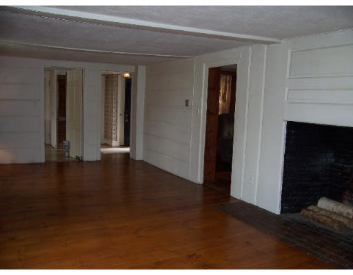 717 Main Street Boxford, MA 01921 - Photo 4 of 9 a view of a livingroom with wooden floor and closet
