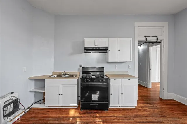 a kitchen with a stove and a refrigerator