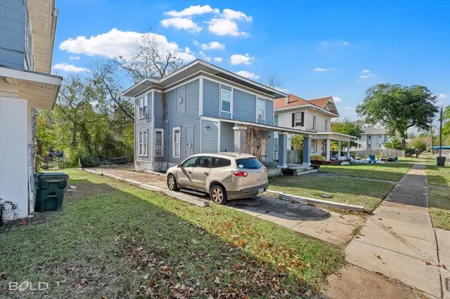 a house view with a garden space