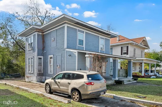 a car parked in front of a house