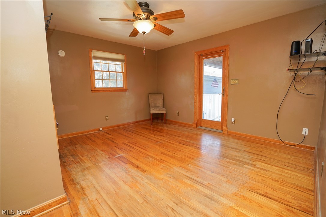 453 Omar Street Struthers, OH 44471 - Photo 19 of 27 Spare room featuring light wood finished floors, healthy amount of natural light, and ceiling fan