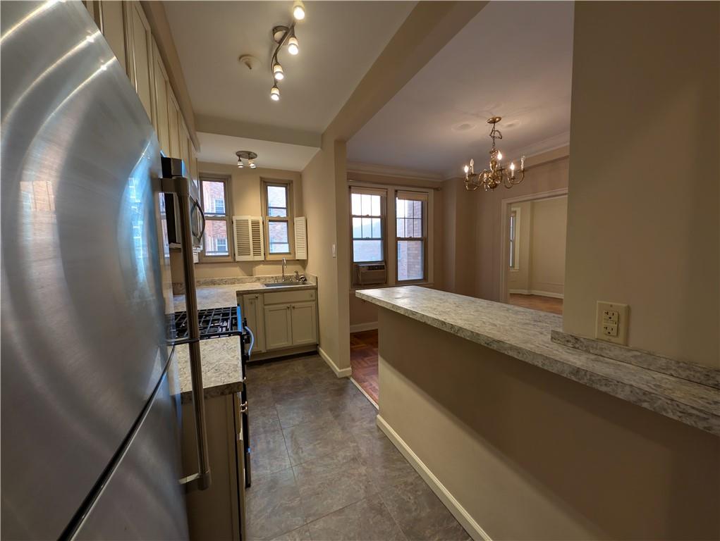 144 North Dithridge Street, Unit 403 Pittsburgh, PA 15213 - Photo 6 of 31 a large white kitchen with a large window